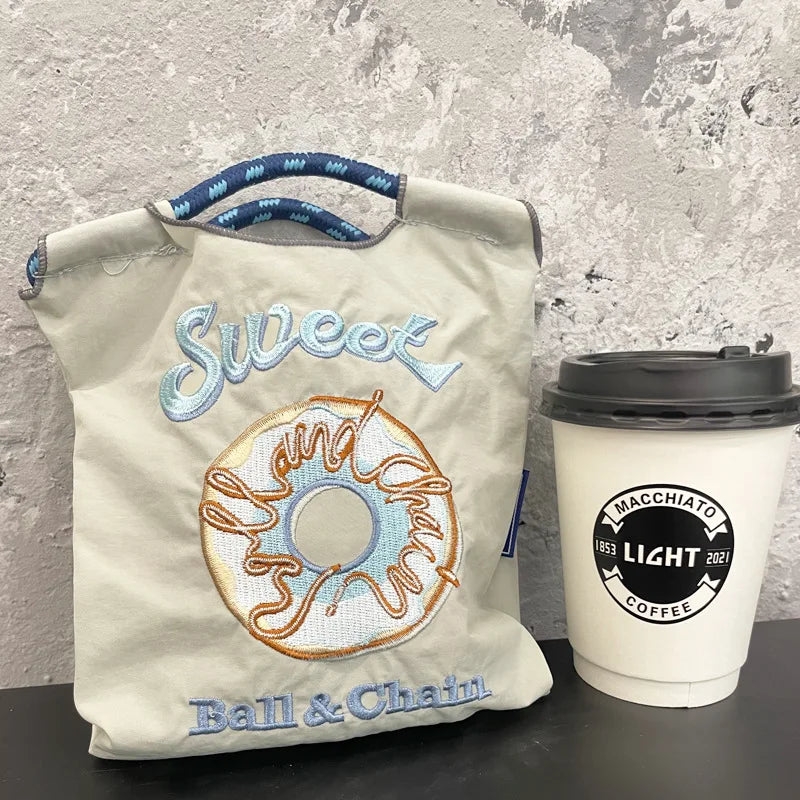 The Mini Embroidered Canvas Messenger Bag