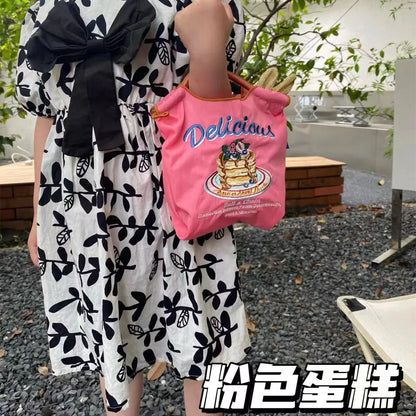 The Mini Embroidered Canvas Messenger Bag