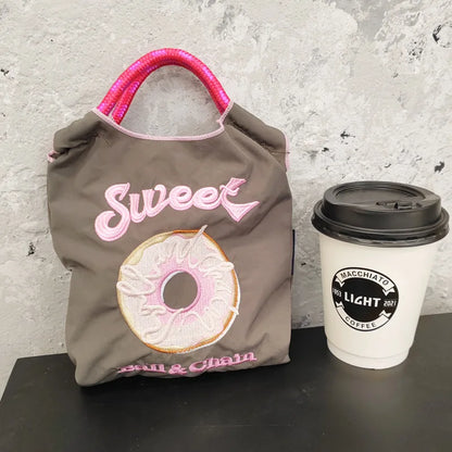 The Mini Embroidered Canvas Messenger Bag