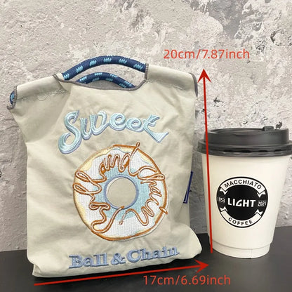 The Mini Embroidered Canvas Messenger Bag