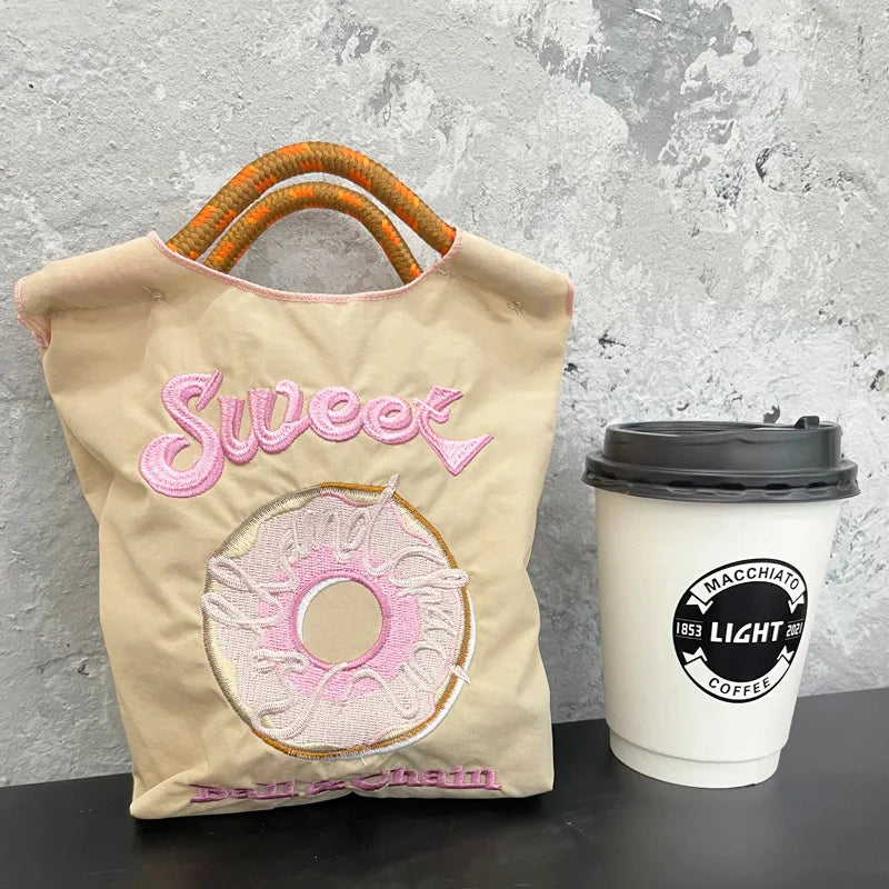 The Mini Embroidered Canvas Messenger Bag