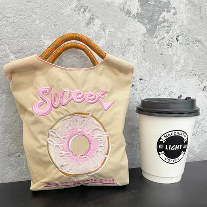 The Mini Embroidered Canvas Messenger Bag