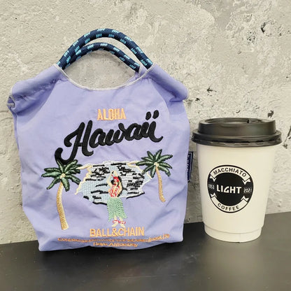 The Mini Embroidered Canvas Messenger Bag